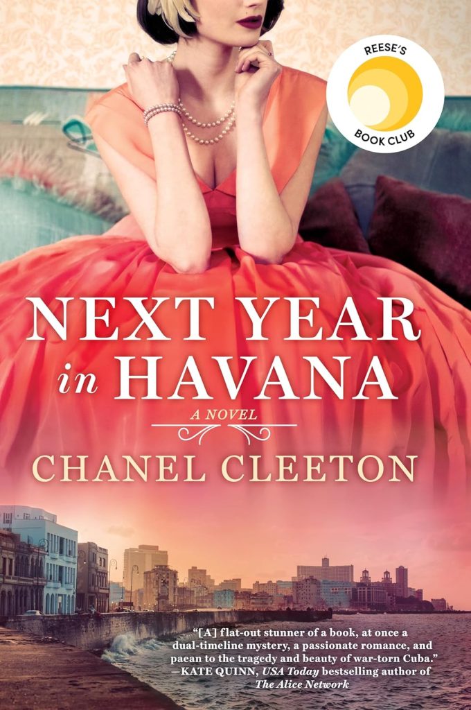 Book cover of "Next Year in Havana" by Chanel Cleeton. Features a woman sitting in a fancy red dress. The hem of the dress fades into a scene of a shore in Cuba.